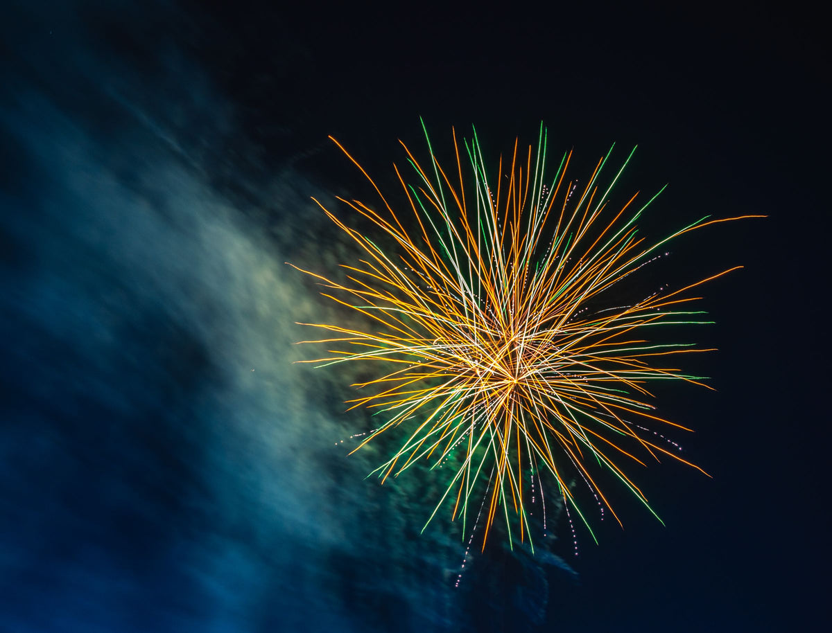 Fireworks lighter needed: a fireworks fountain exploding in a dark night sky
